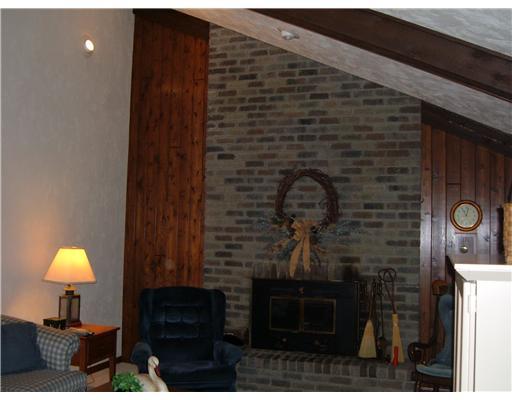 126 Spring Hollow Drive Apollo, PA 15613 - Photo 7 of 12 Den/Family/Great Room. notice the soaring ceiling and recessed lighting in family room off kitchen. Wall of brick and heatilator in log burning fireplace!