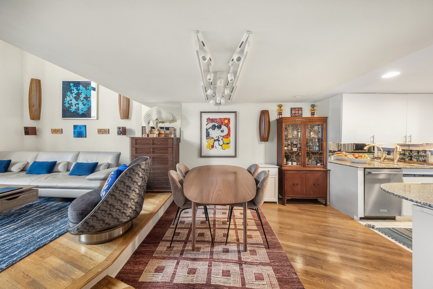 135 West 70th Street, Unit 6M Manhattan, NY 10023 - Photo 3 of 11 a living room with furniture and kitchen view
