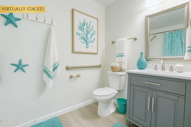 a bathroom with a sink a toilet and a window