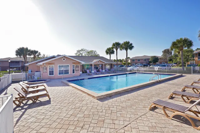 a view of swimming pool with chairs