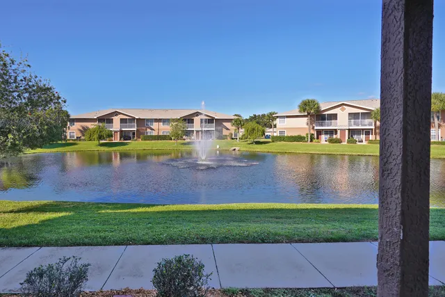 a front view of a house with a lake view