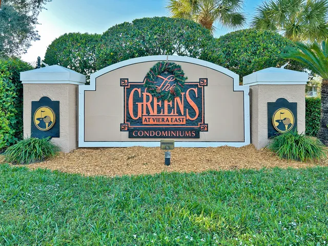 a sign that is on the side of the house