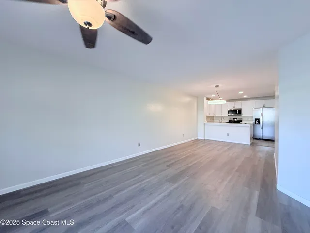 a view of a kitchen with a sink and dishwasher