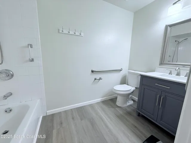 a bathroom with a sink a toilet and a bathtub