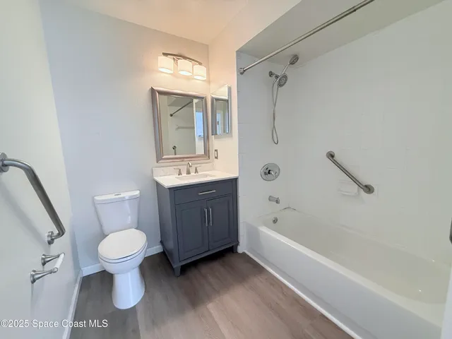 a bathroom with a toilet a sink and a bathtub
