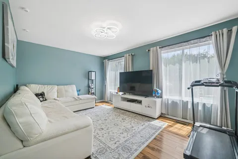 a living room with a flat screen tv and a couch