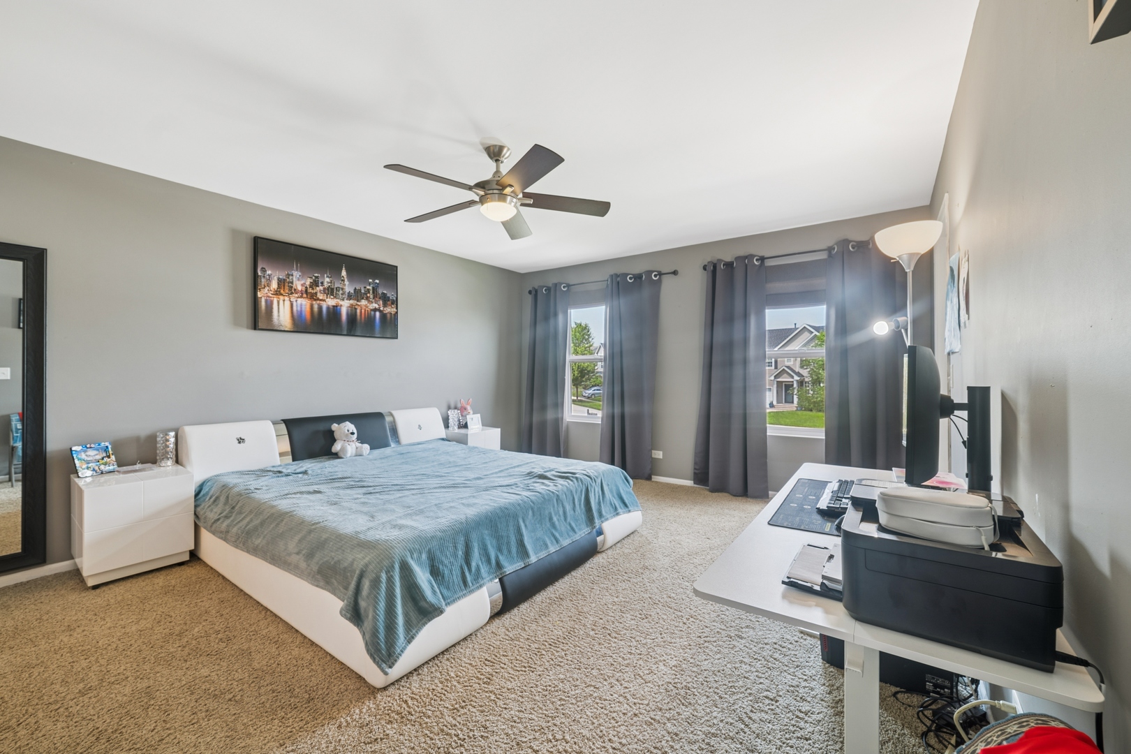 560 Canterbury Lane Pingree Grove, IL 60140 - Photo 5 of 15 a spacious bedroom with a bed a dresser and a chandelier