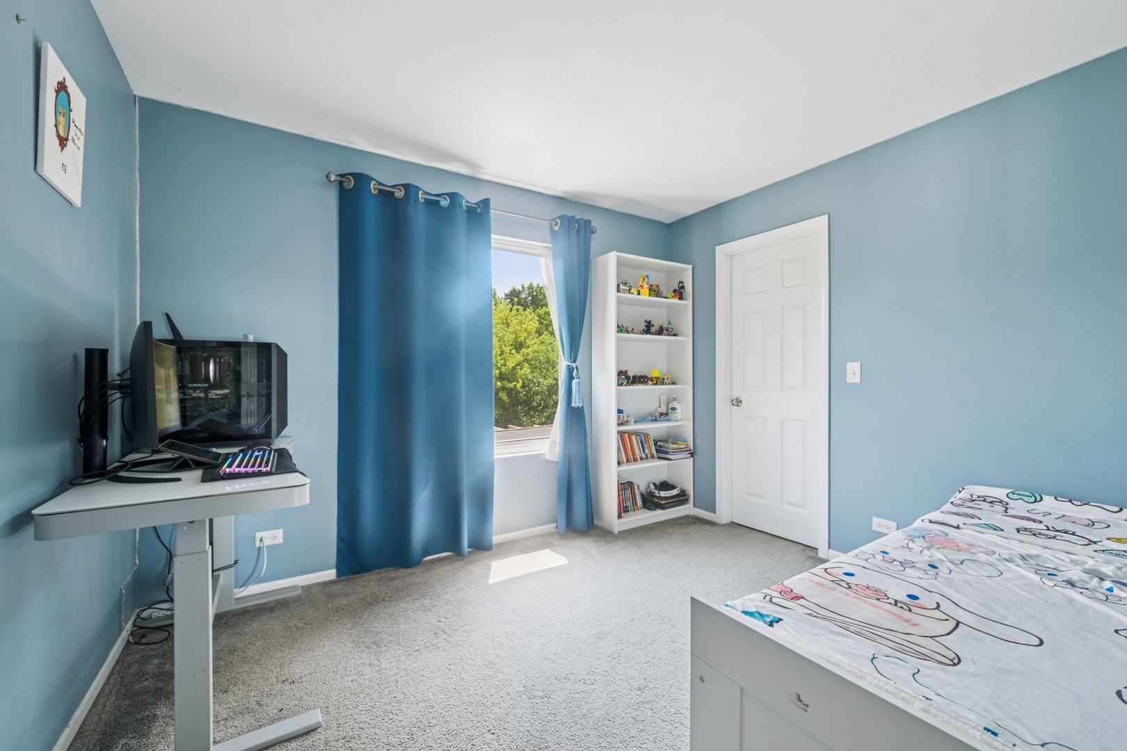 560 Canterbury Lane Pingree Grove, IL 60140 - Photo 6 of 15 a bedroom with a bed and a television