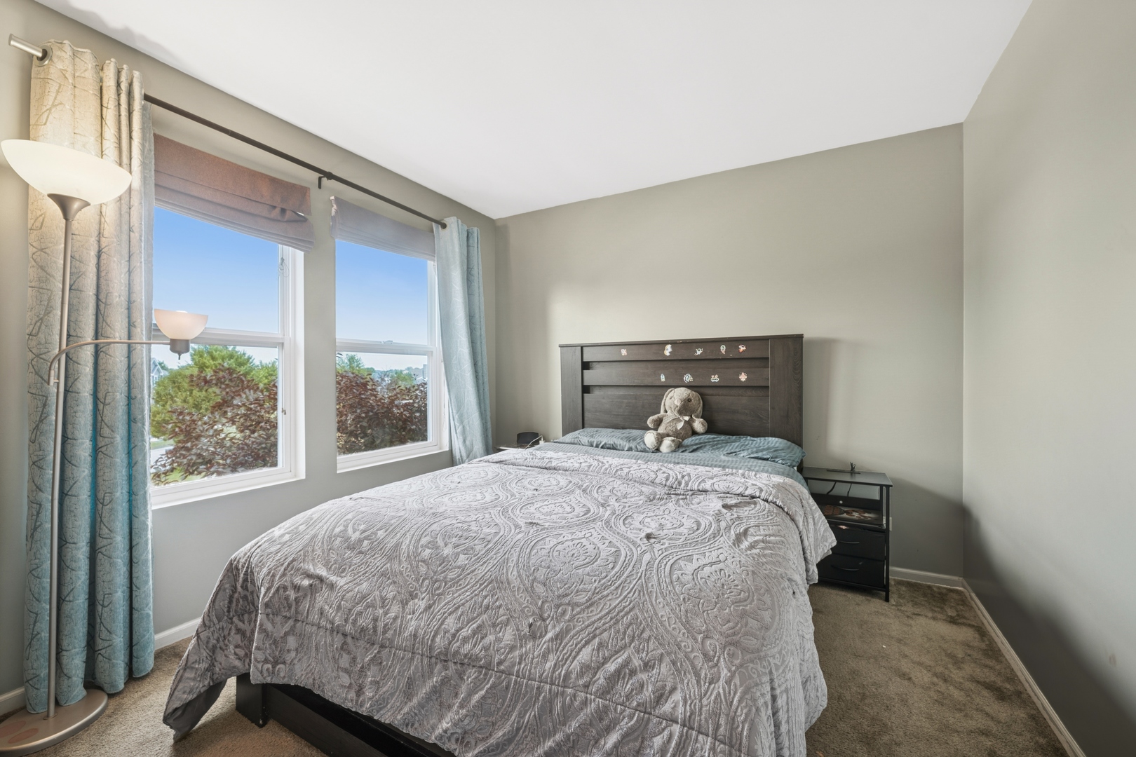 560 Canterbury Lane Pingree Grove, IL 60140 - Photo 8 of 15 a bedroom with a bed and wooden floor