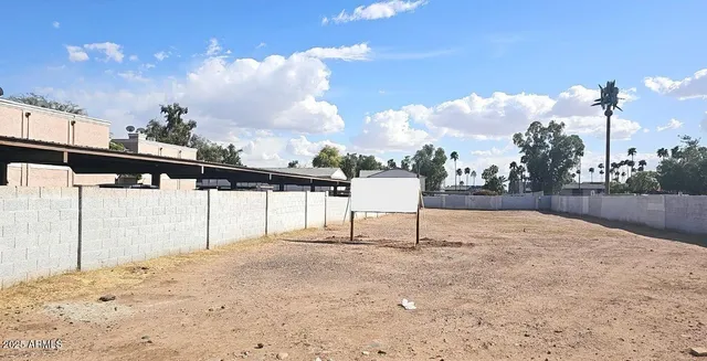 a view of swimming pool with a dining table and chairs