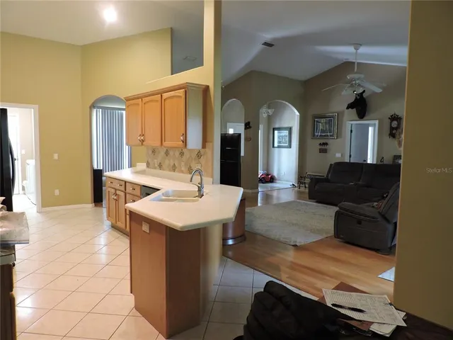 a view of living room with granite countertop furniture and fireplace