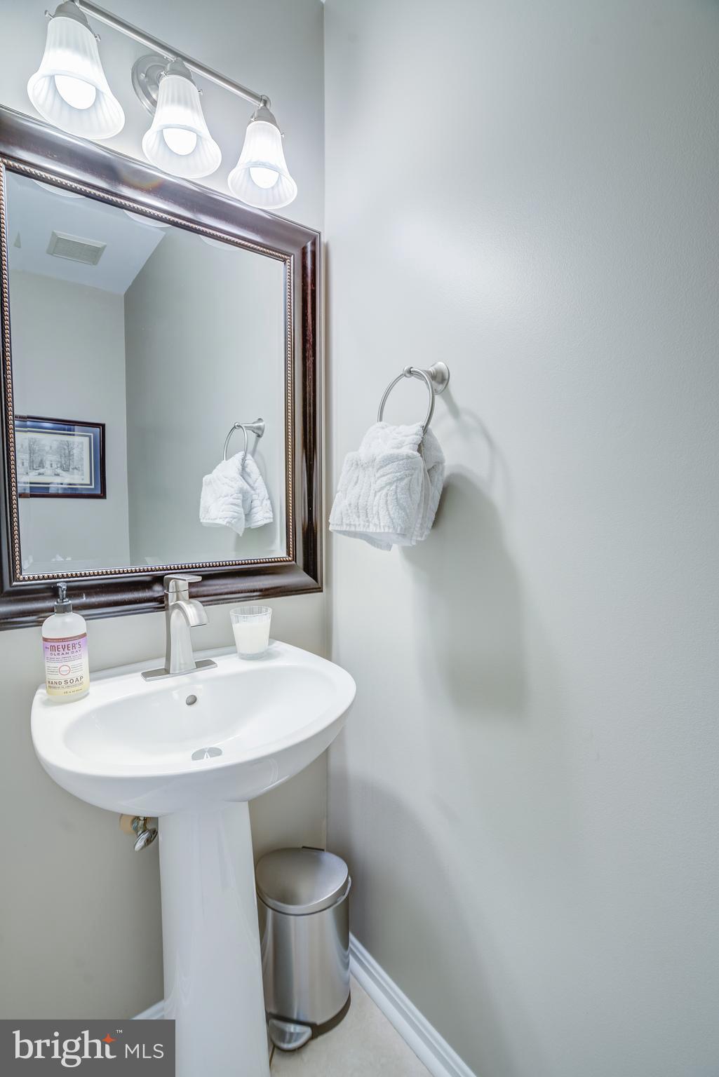 8529 High Timber Court Ellicott City, MD 21043 - Photo 32 of 94 a bathroom with a toilet sink and mirror