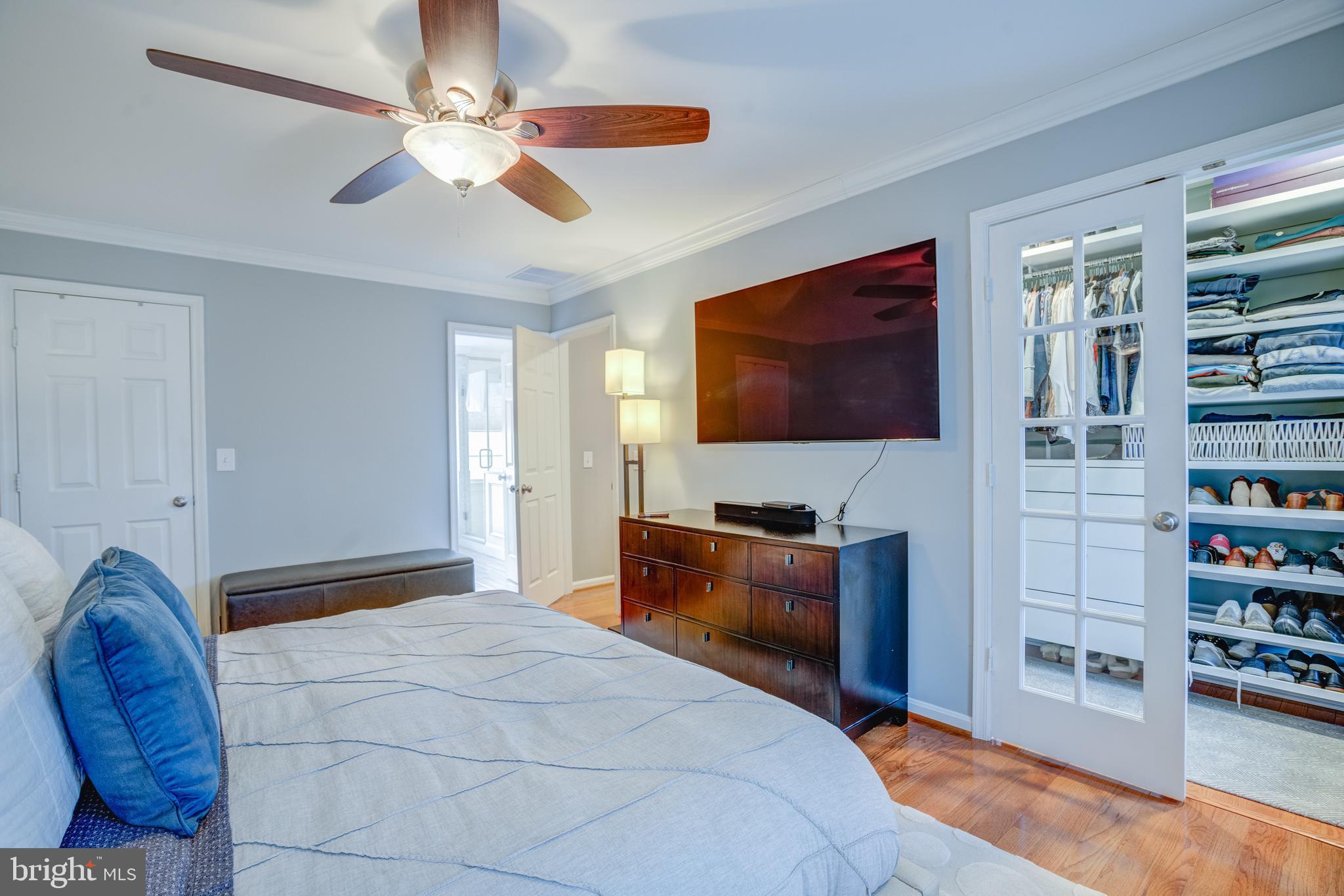 8529 High Timber Court Ellicott City, MD 21043 - Photo 34 of 94 a bedroom with furniture and a flat screen tv