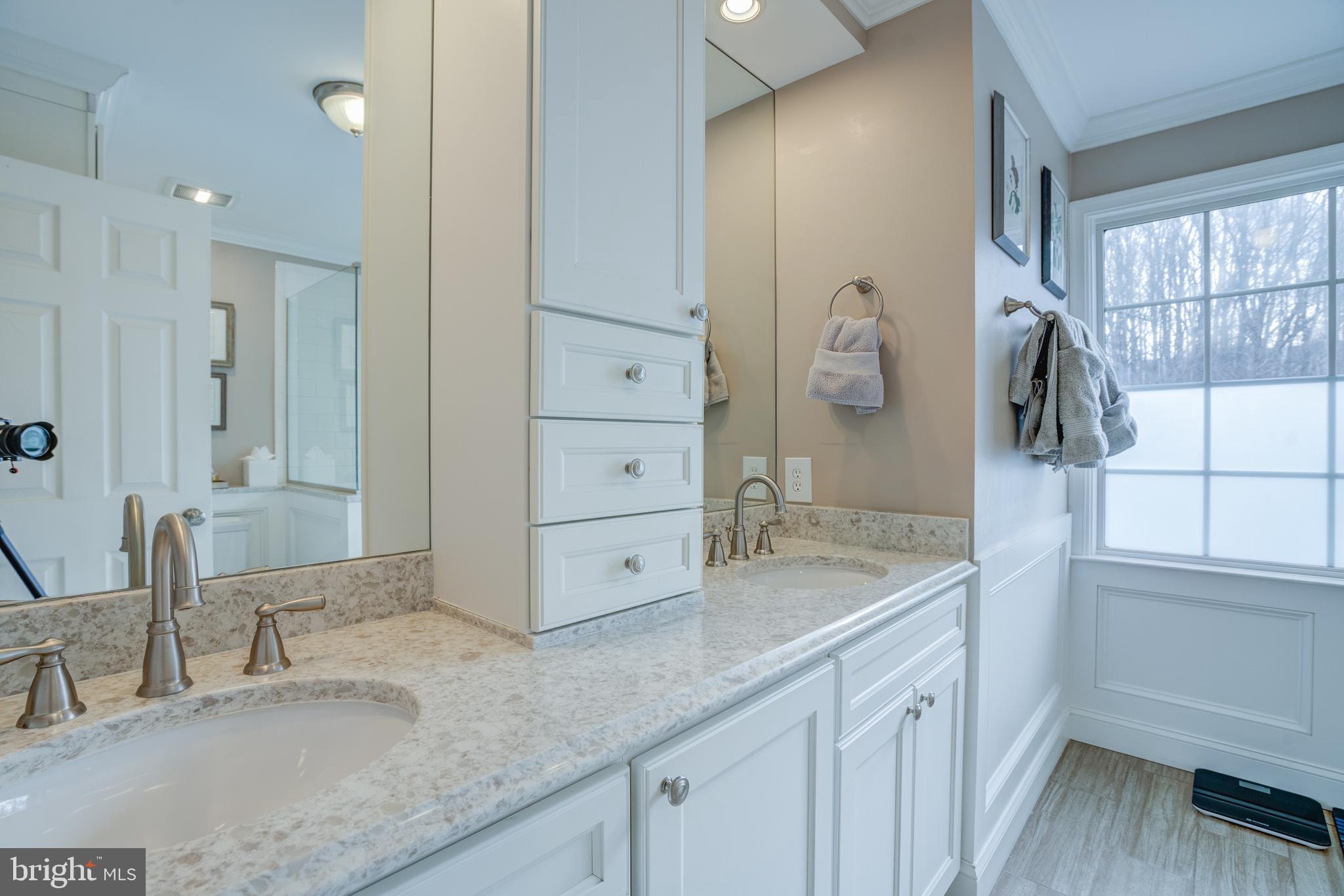 8529 High Timber Court Ellicott City, MD 21043 - Photo 38 of 94 a bathroom with a granite countertop sink and a mirror