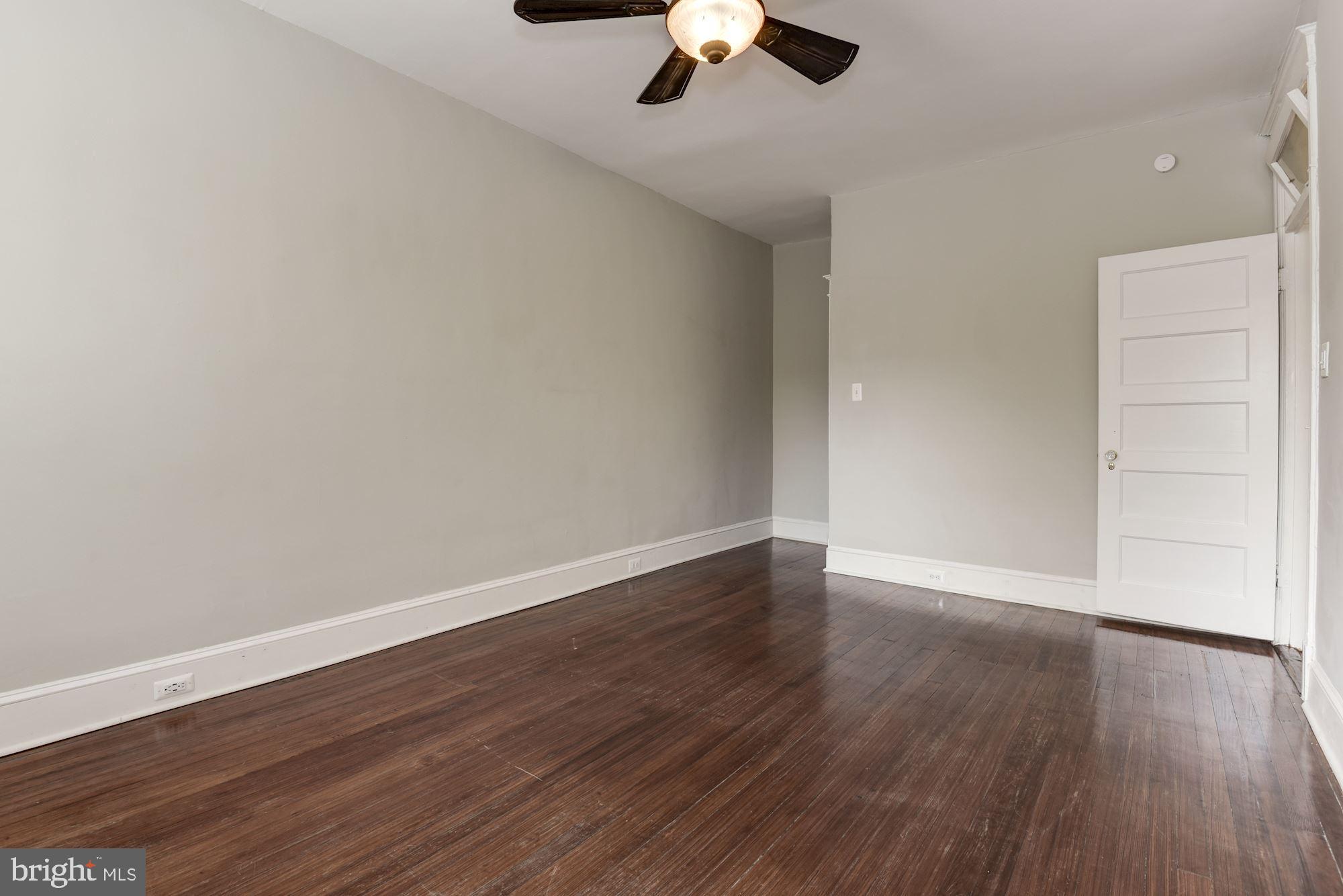 1227 Park Road Northwest Washington, DC 20010 - Photo 22 of 30 Master bedroom with ceiling fan and wood floors