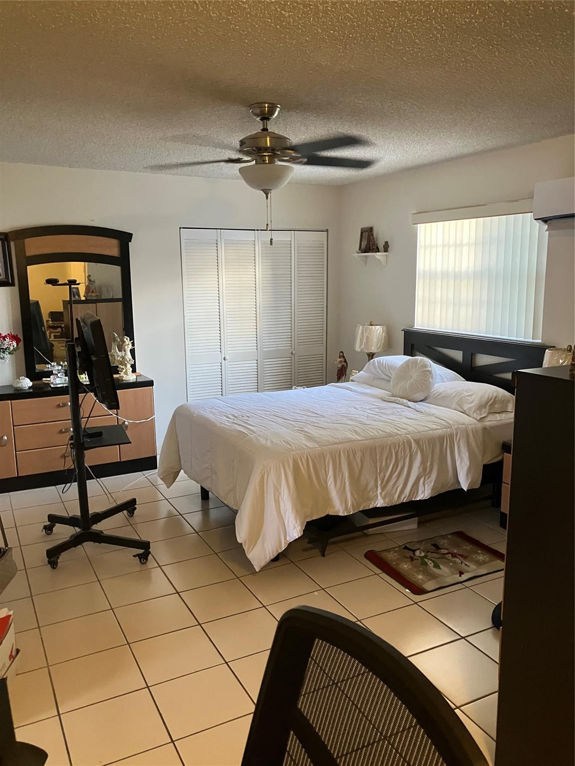 7960 Northwest 174th Street Hialeah, FL 33015 - Photo 11 of 22 a bedroom with a bed and wooden floor