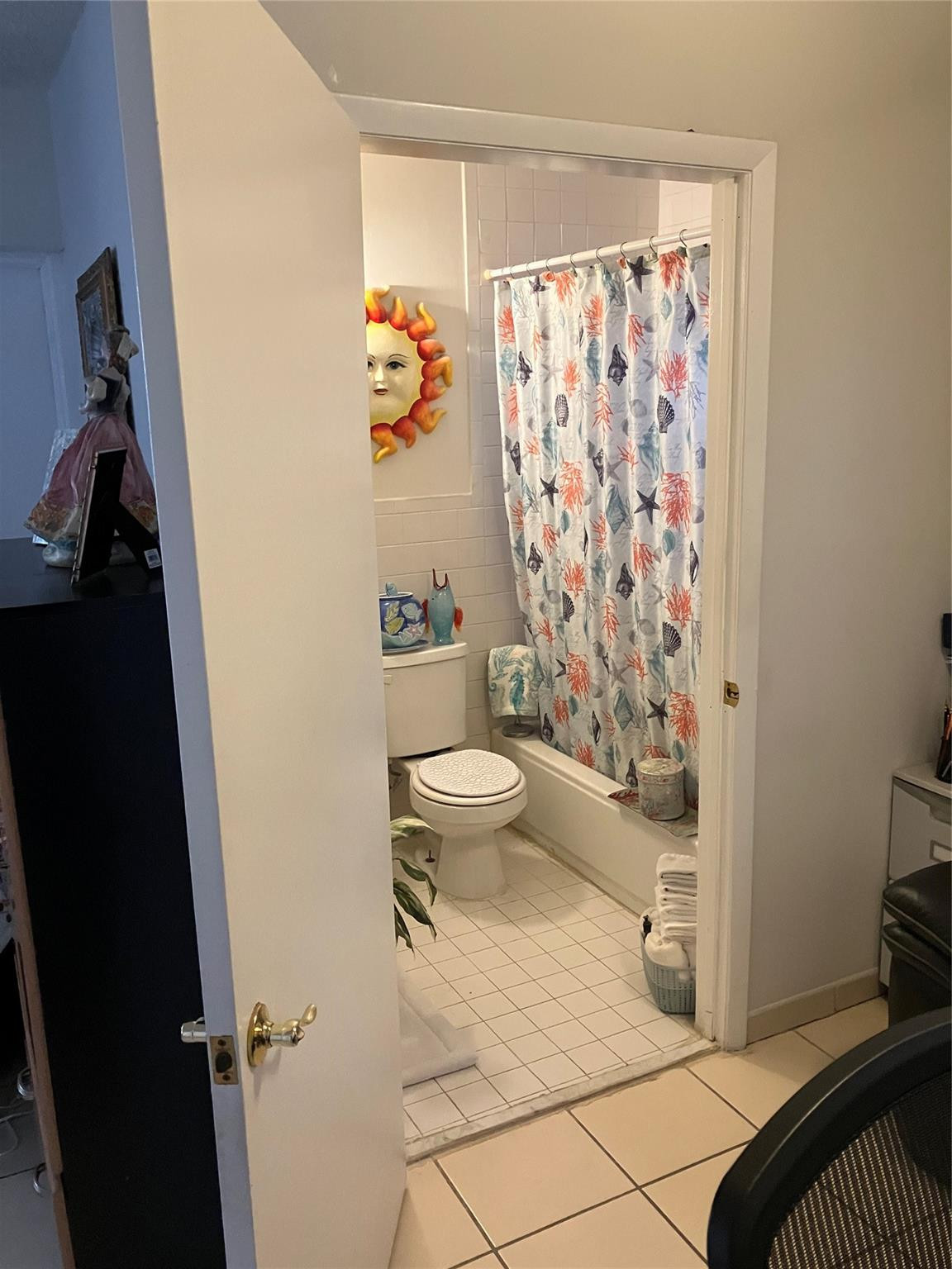 7960 Northwest 174th Street Hialeah, FL 33015 - Photo 12 of 22 a bathroom with a toilet and a shower curtain
