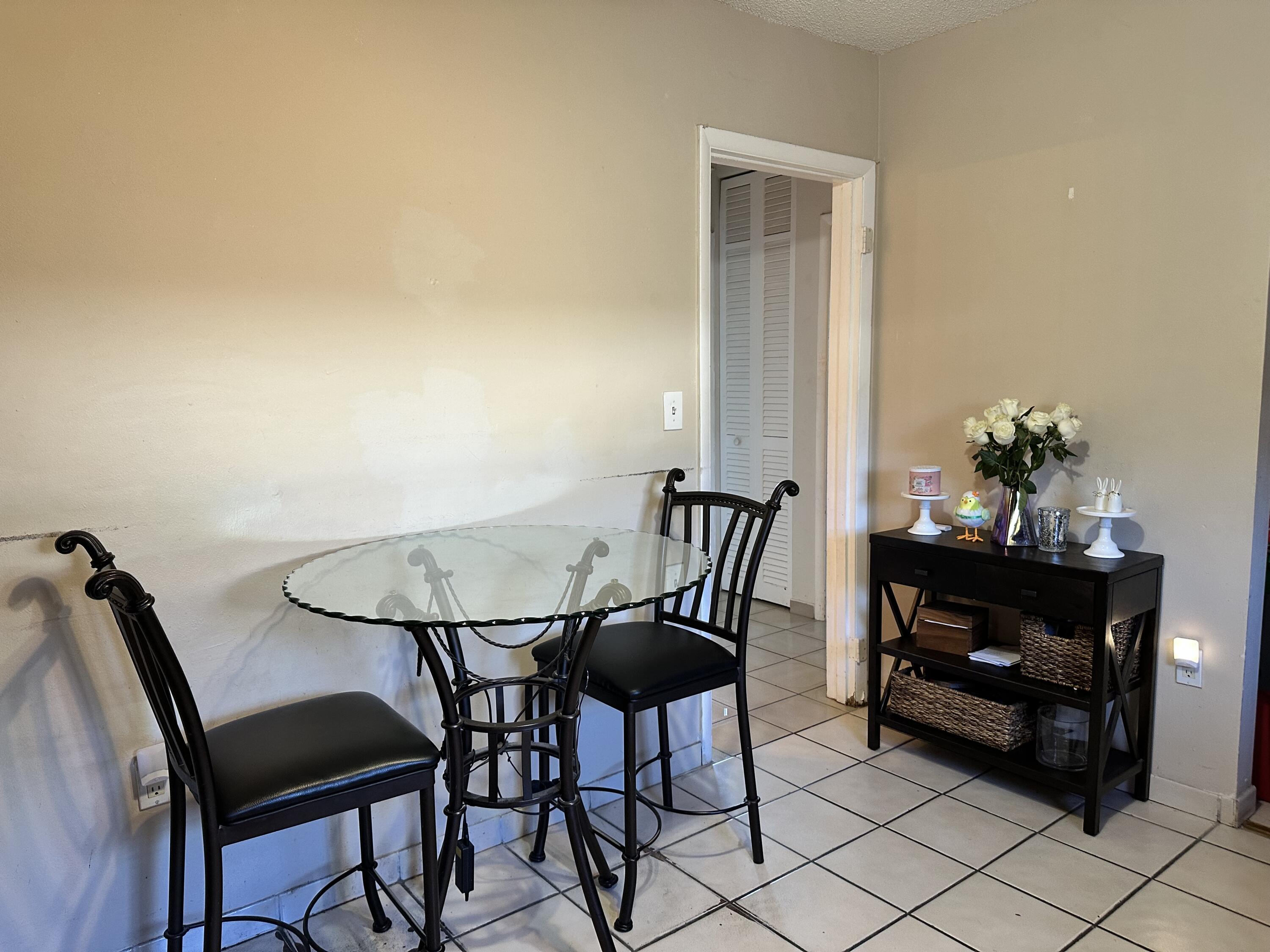 7960 Northwest 174th Street Hialeah, FL 33015 - Photo 15 of 22 a view of a dining room with furniture and wooden floor