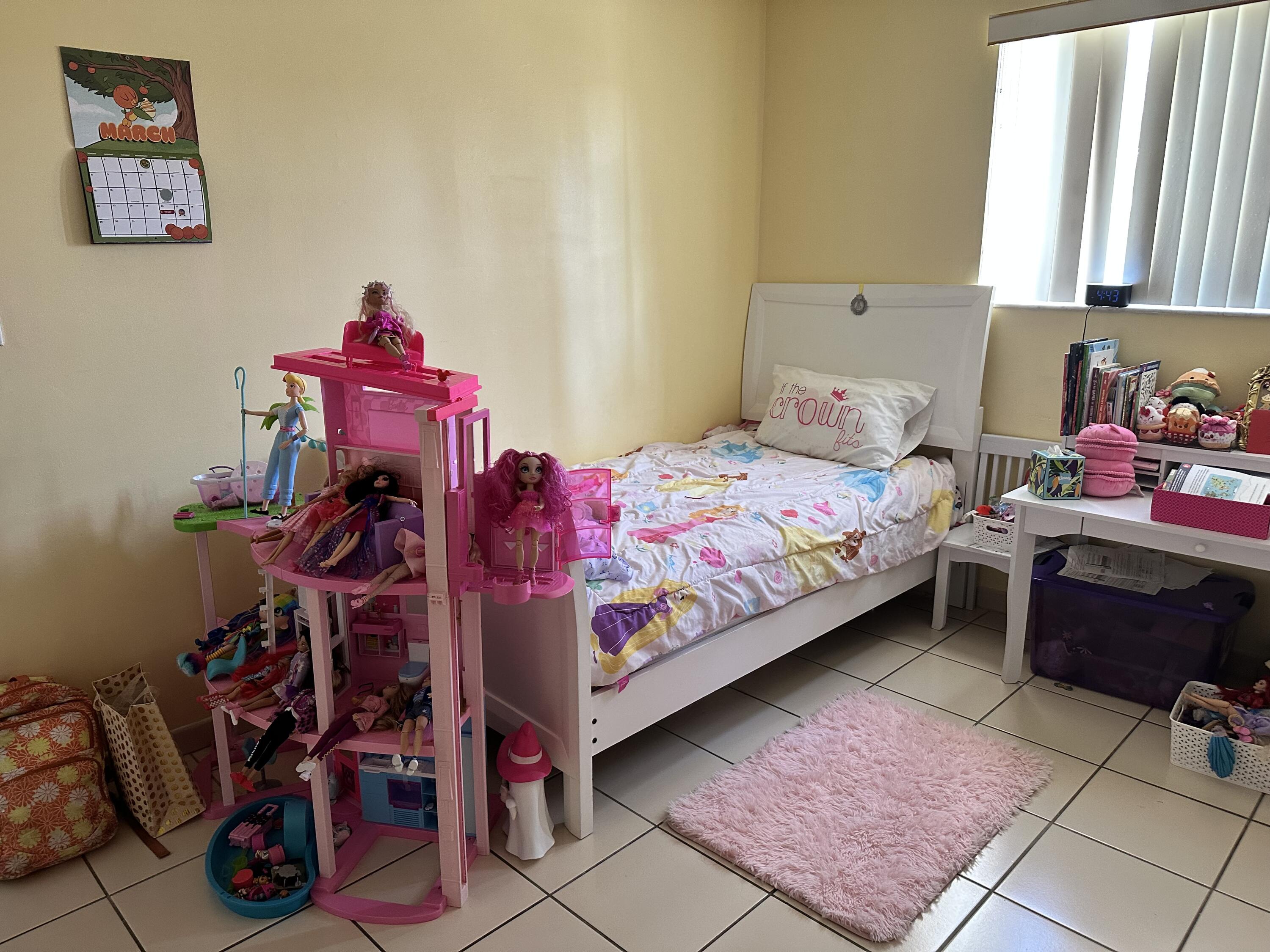 7960 Northwest 174th Street Hialeah, FL 33015 - Photo 19 of 22 a bedroom with a bed and a table in it