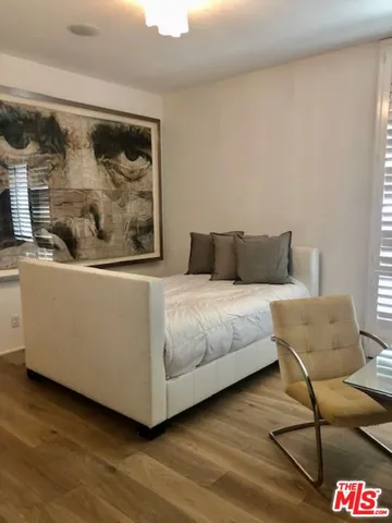 a bathroom with a toilet sink and shower