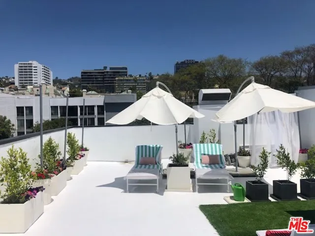 a living room with a fireplace and a flat screen tv