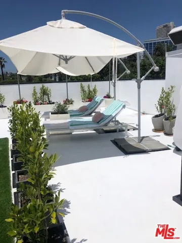 a living room with a fireplace and a flat screen tv