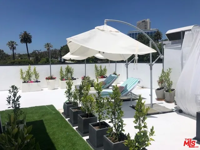 a bedroom with a bed and a table