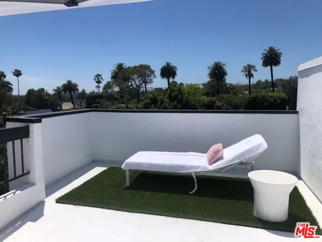 a bathroom with a shower and a sink