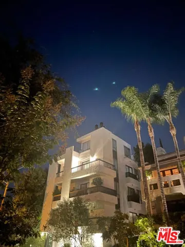 a building with trees in front of it