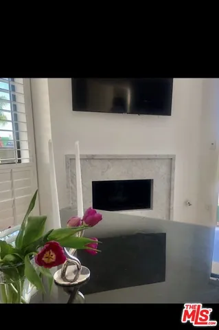 a view of a livingroom with furniture and a flat screen tv