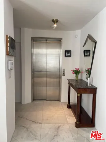 a dining room with a sink and a mirror