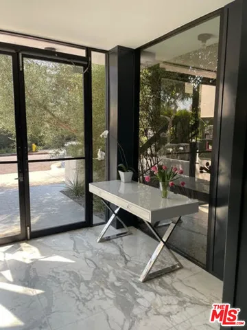 a kitchen with a sink and large cabinets