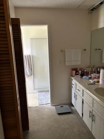 a bathroom with a double vanity sink and mirror