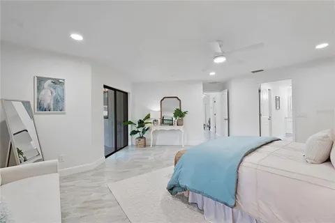 a bedroom with a bed and a couch