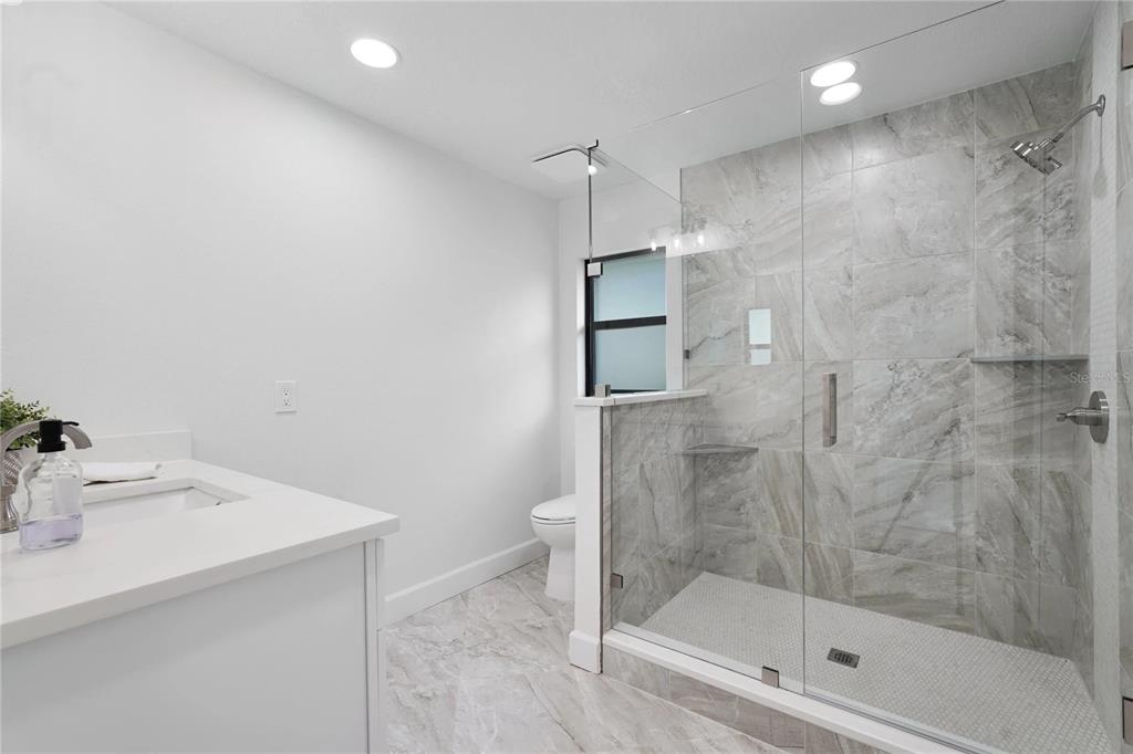 5012 South Deepwater Point Homosassa, FL 34448 - Photo 18 of 42 a bathroom with a shower and a sink