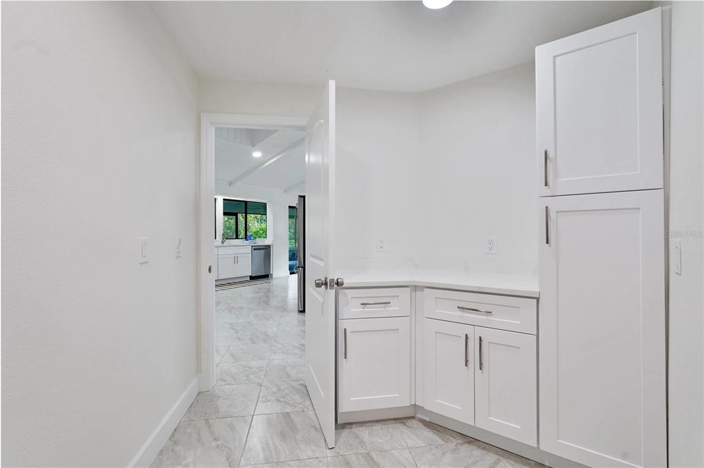 5012 South Deepwater Point Homosassa, FL 34448 - Photo 22 of 42 a view of a kitchen with white cabinets