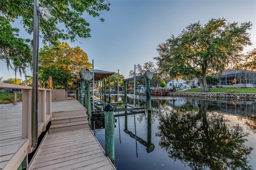 5012 South Deepwater Point Homosassa, FL 34448 - Photo 28 of 42 a view of a lake with wooden bridge