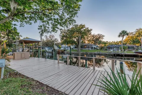 a view of a balcony with wooden floor and outdoor space