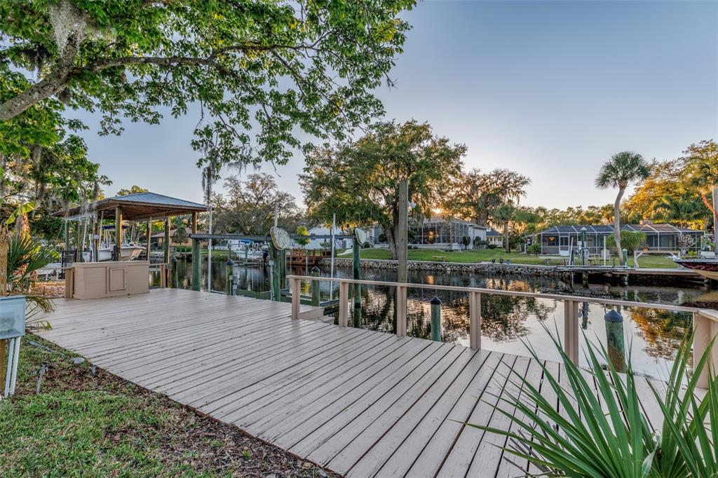 5012 South Deepwater Point Homosassa, FL 34448 - Photo 29 of 42 a balcony with wooden floor and lake view