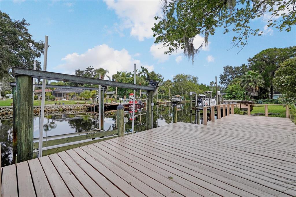 5012 South Deepwater Point Homosassa, FL 34448 - Photo 30 of 42 a view of a balcony with wooden floor and fence