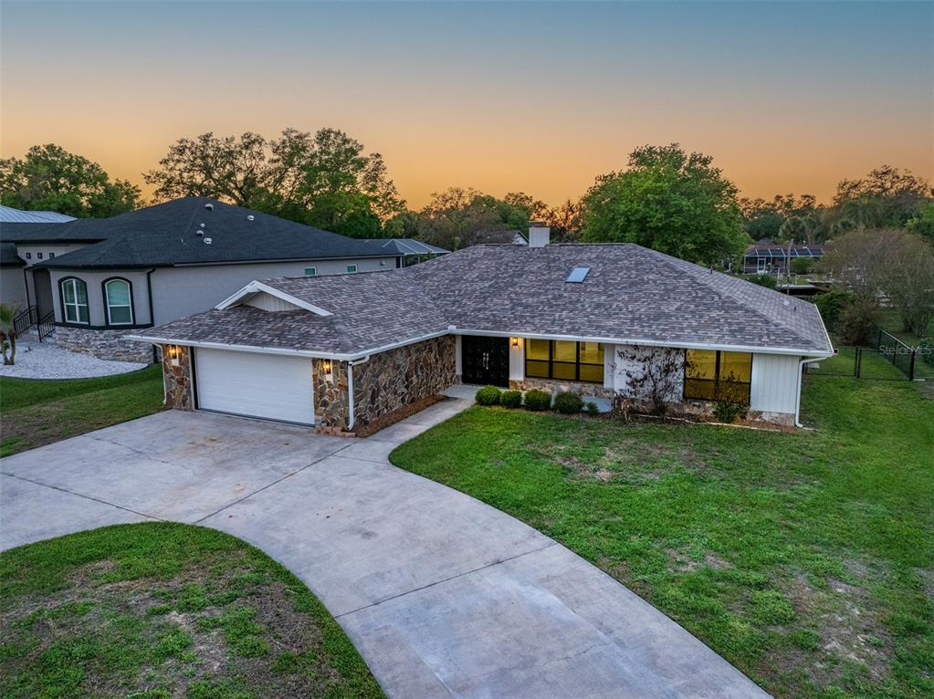 5012 South Deepwater Point Homosassa, FL 34448 - Photo 3 of 42 a view of a house with a big yard plants and large trees