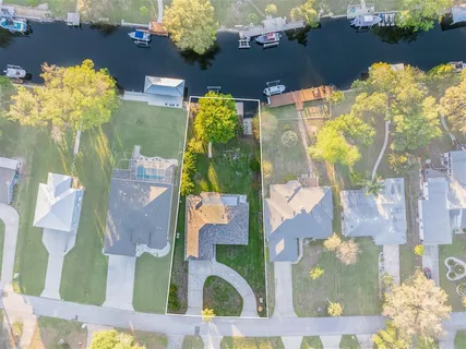 an aerial view of residential houses with outdoor space