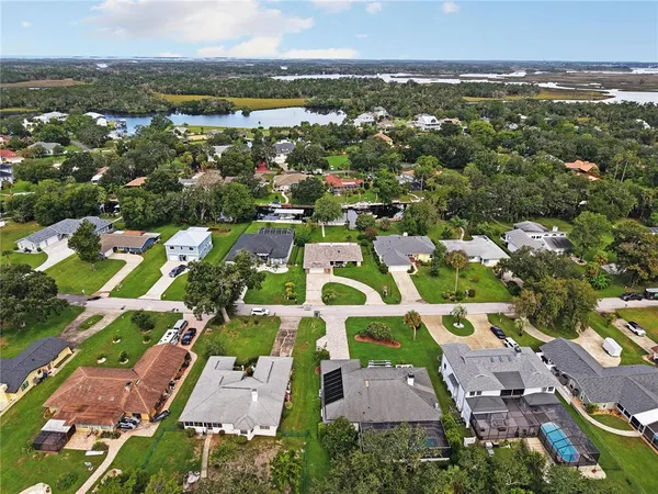 an aerial view of residential houses and outdoor space