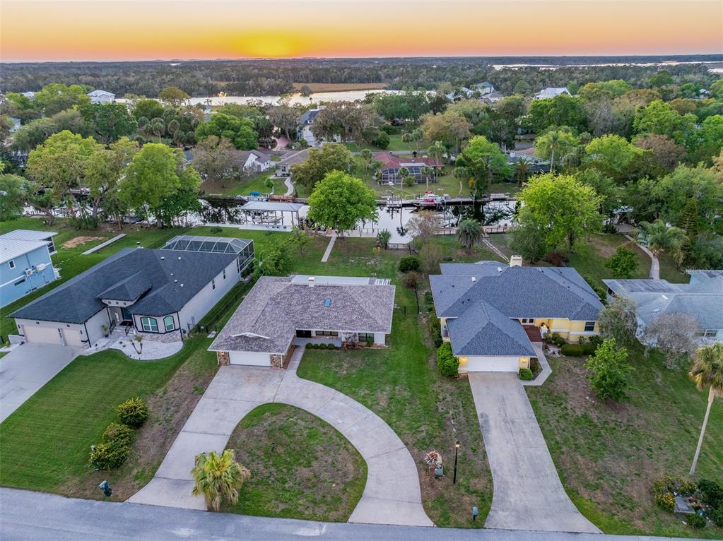 5012 South Deepwater Point Homosassa, FL 34448 - Photo 41 of 42 an aerial view of multiple houses with a yard