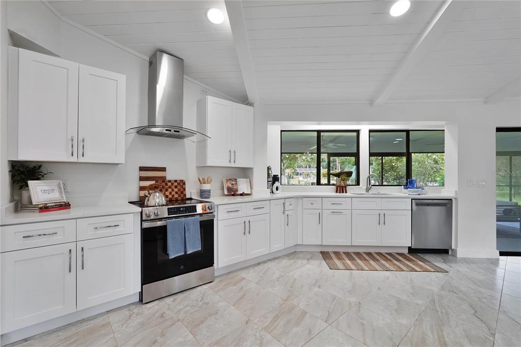 5012 South Deepwater Point Homosassa, FL 34448 - Photo 8 of 42 a kitchen with a sink stove and window