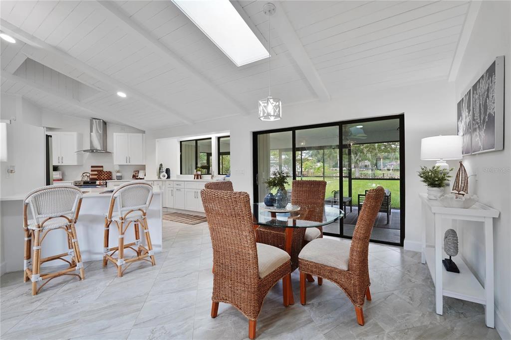 5012 South Deepwater Point Homosassa, FL 34448 - Photo 10 of 42 a view of a dining room with furniture window and outside view