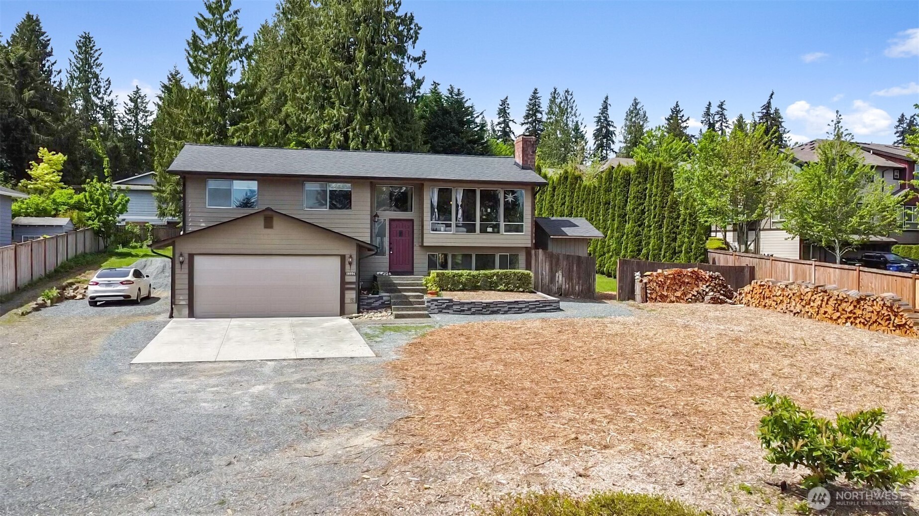 16604 3rd Avenue Southeast Bothell, WA 98012 - Photo 1 of 1 a front view of a house with a yard and garage