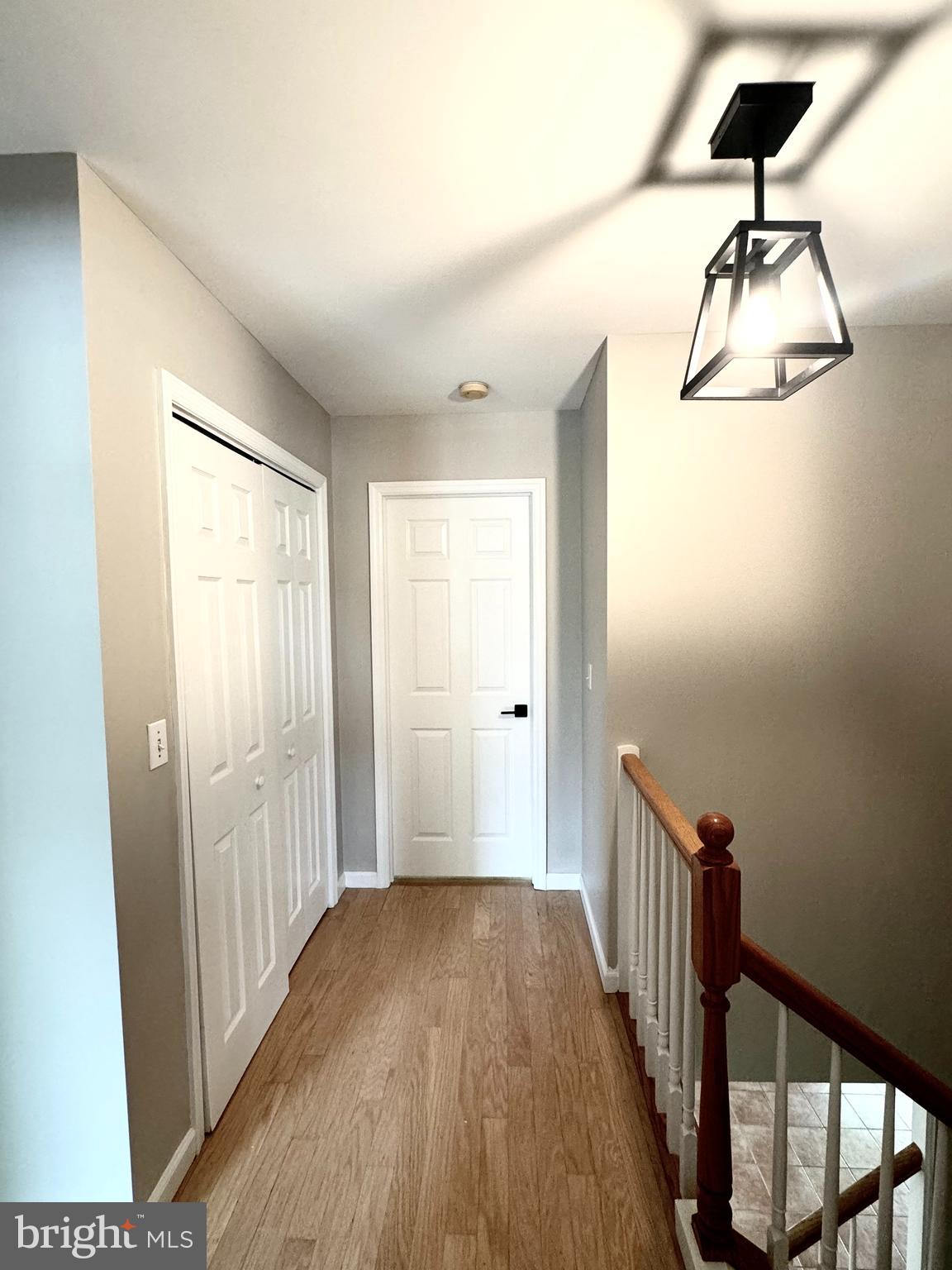 262 Crescent Drive Hershey, PA 17033 - Photo 16 of 25 a view of a hallway with wooden floor and staircase