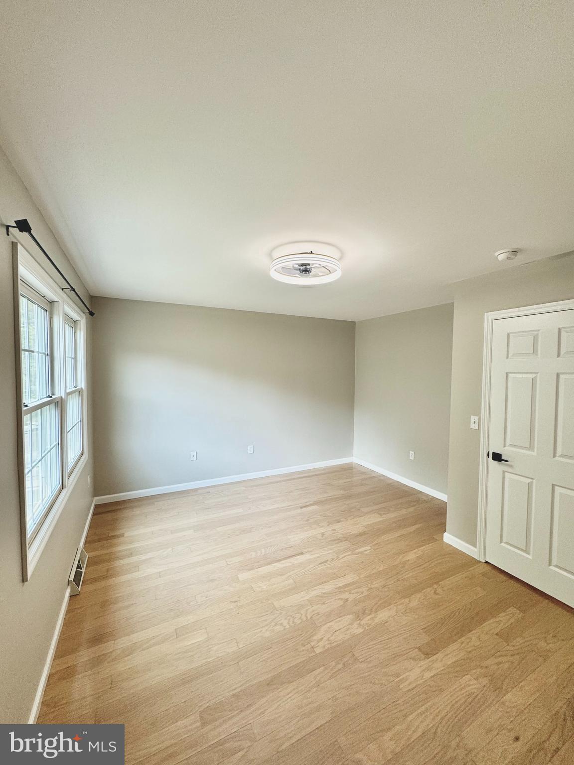 262 Crescent Drive Hershey, PA 17033 - Photo 17 of 25 wooden floor in an empty room with a window