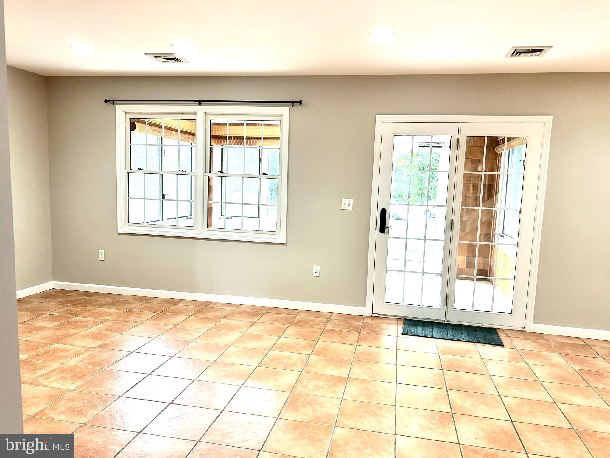 262 Crescent Drive Hershey, PA 17033 - Photo 7 of 25 a view of an empty room with window and a kitchen